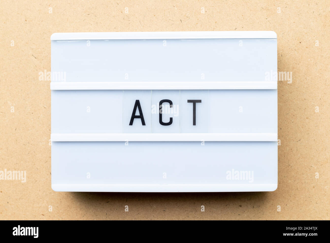 White lightbox with word act on wood background Stock Photo