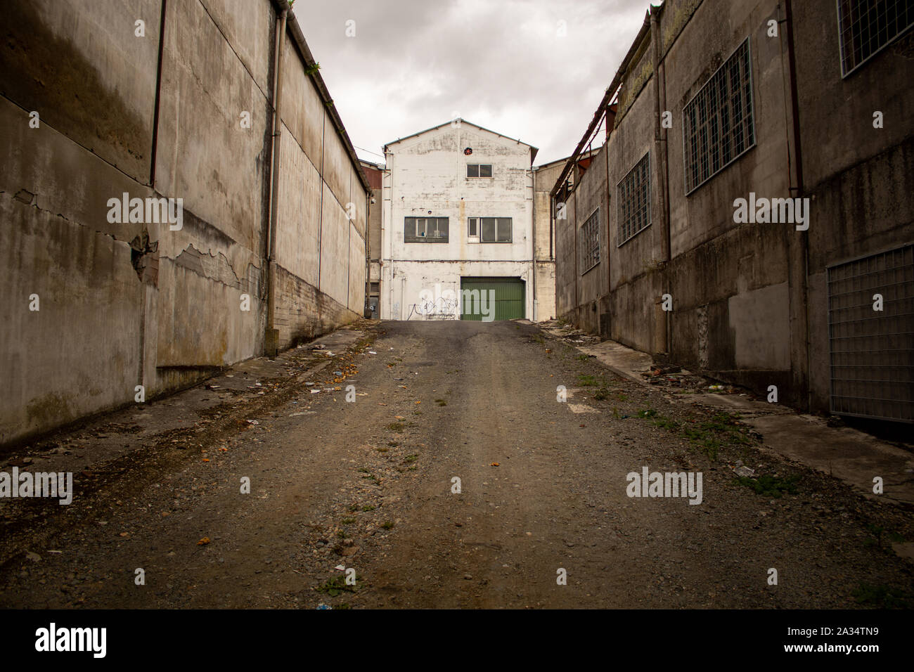 Coruna / Spain - October 04 2019: Abandoned warehouse buildings with broken windows and shutters in Coruna Spain. Stock Photo