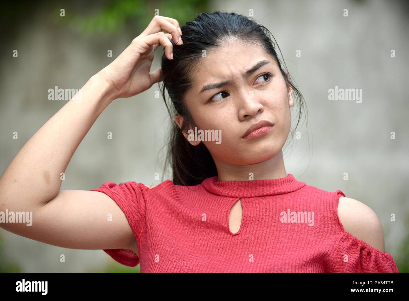 A Young Filipina Female And Confusion Stock Photo - Alamy