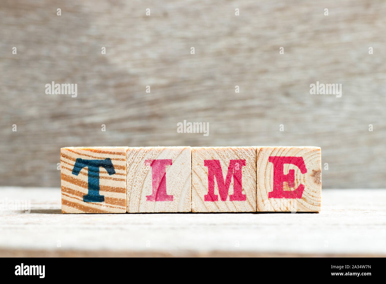 Alphabet letter block in word time on wood background Stock Photo - Alamy