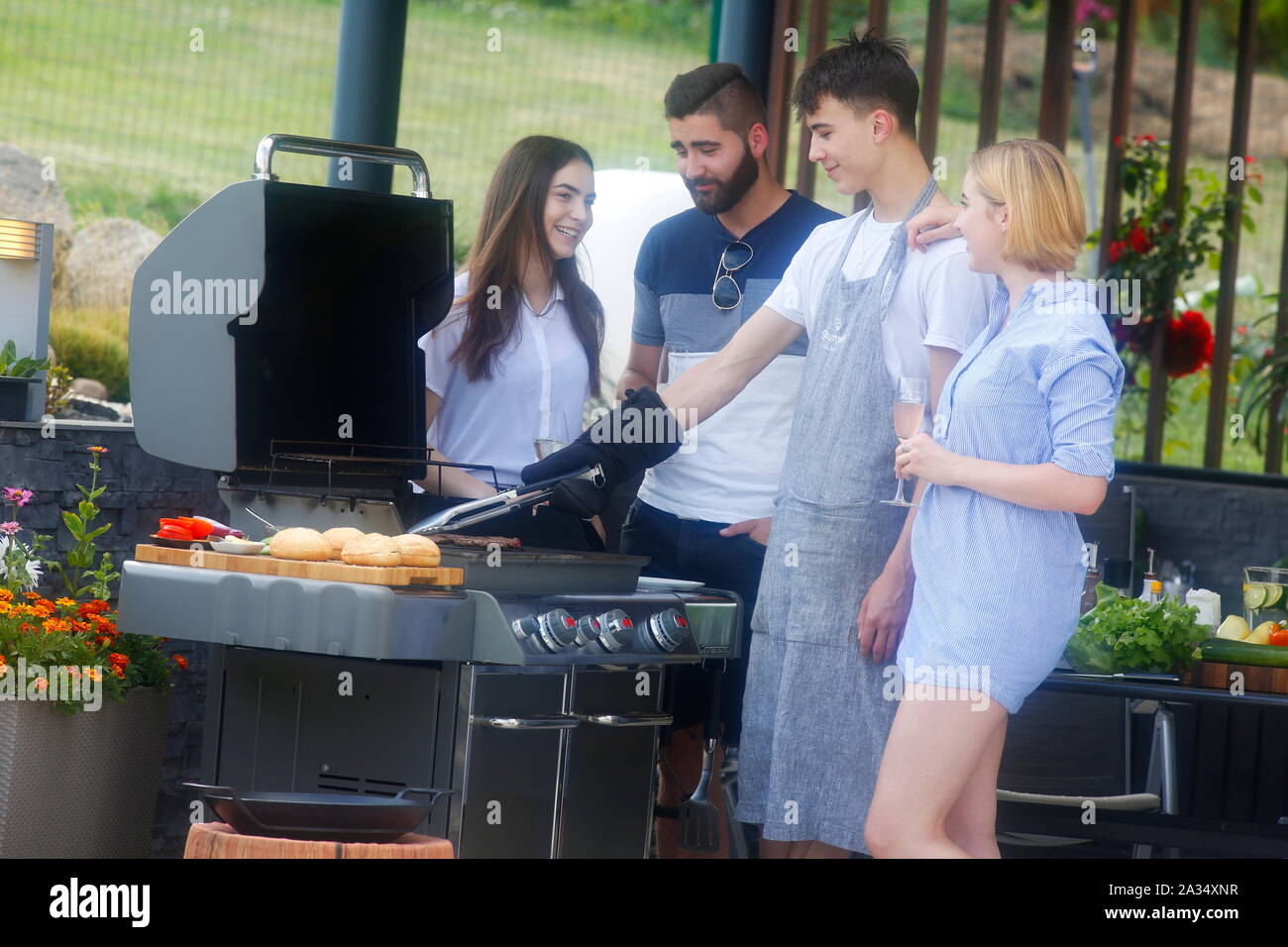 Young people at barbecues, Carlsbad, Czech Republic Stock Photo