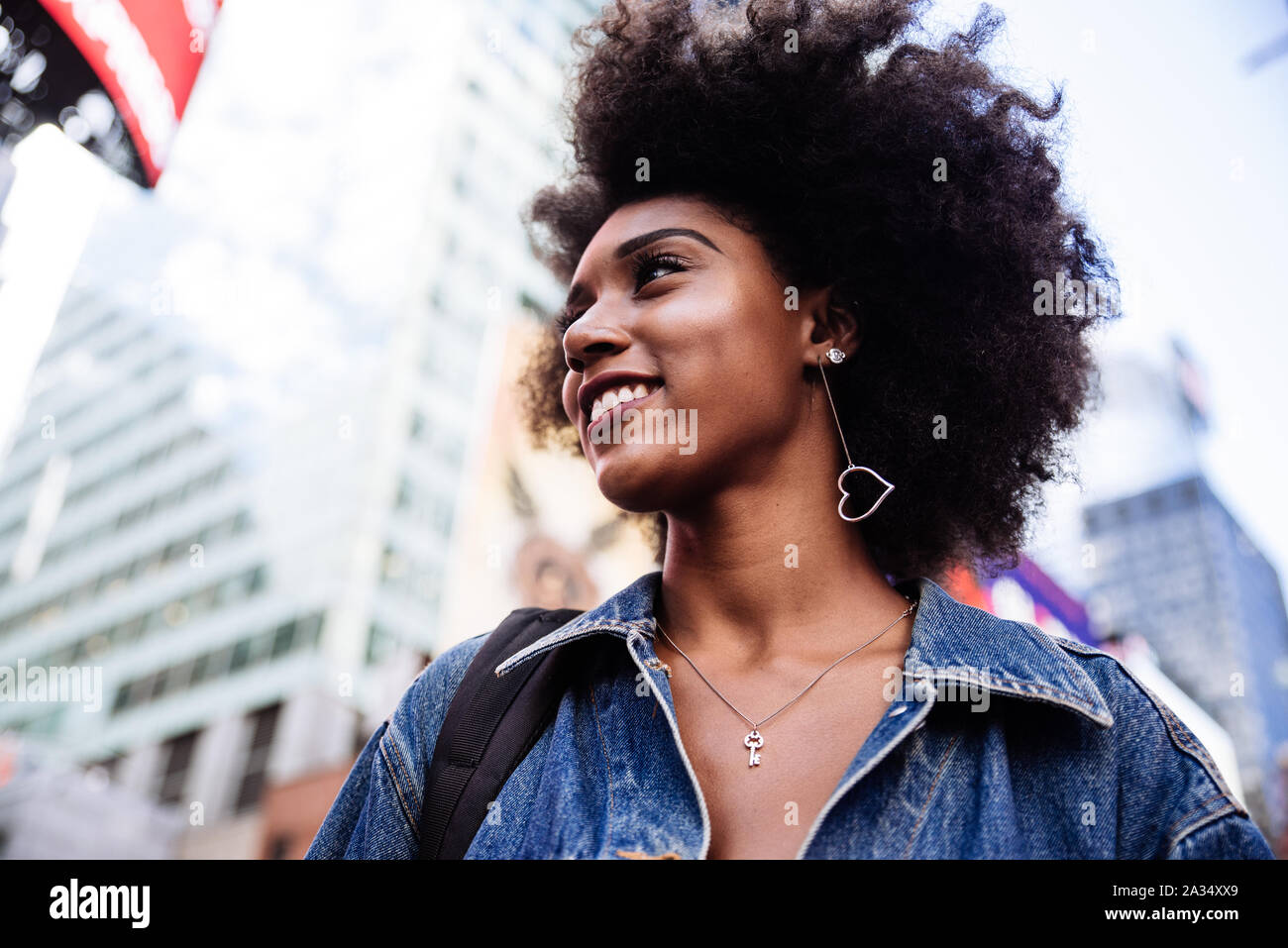 Young beautiful girl walking in Time square, manhattan. Lifestyle concepts about New york Stock Photo