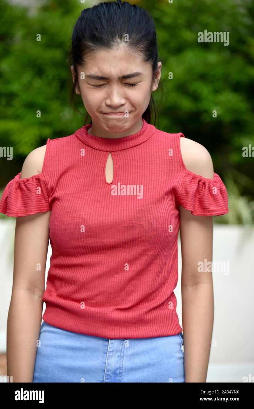 An An Anxious Asian Girl Stock Photo - Alamy