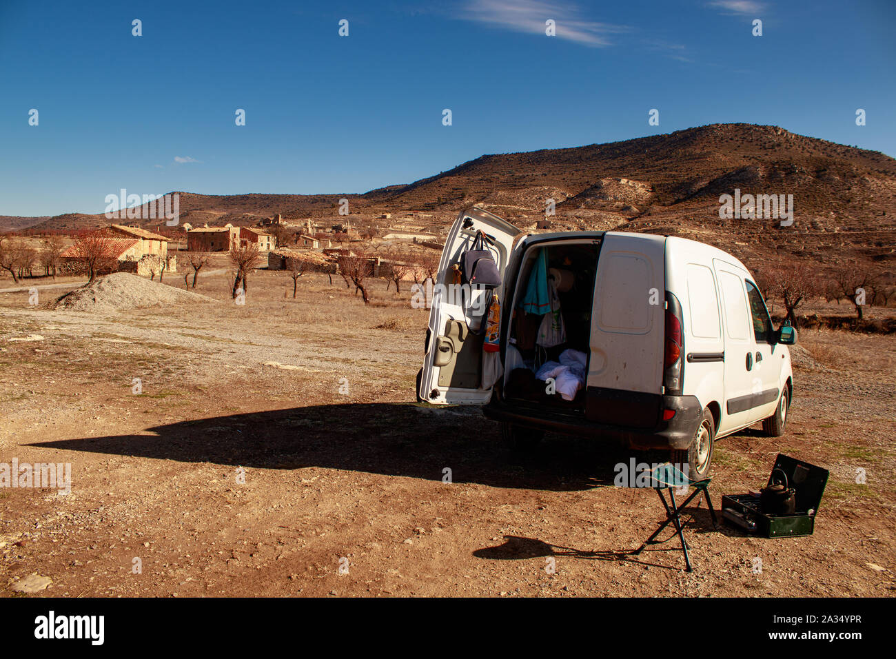 Teruel / Spain - January 30 2018: Van life explorer tourist parked outside abandoned village in Teruel Spain Stock Photo