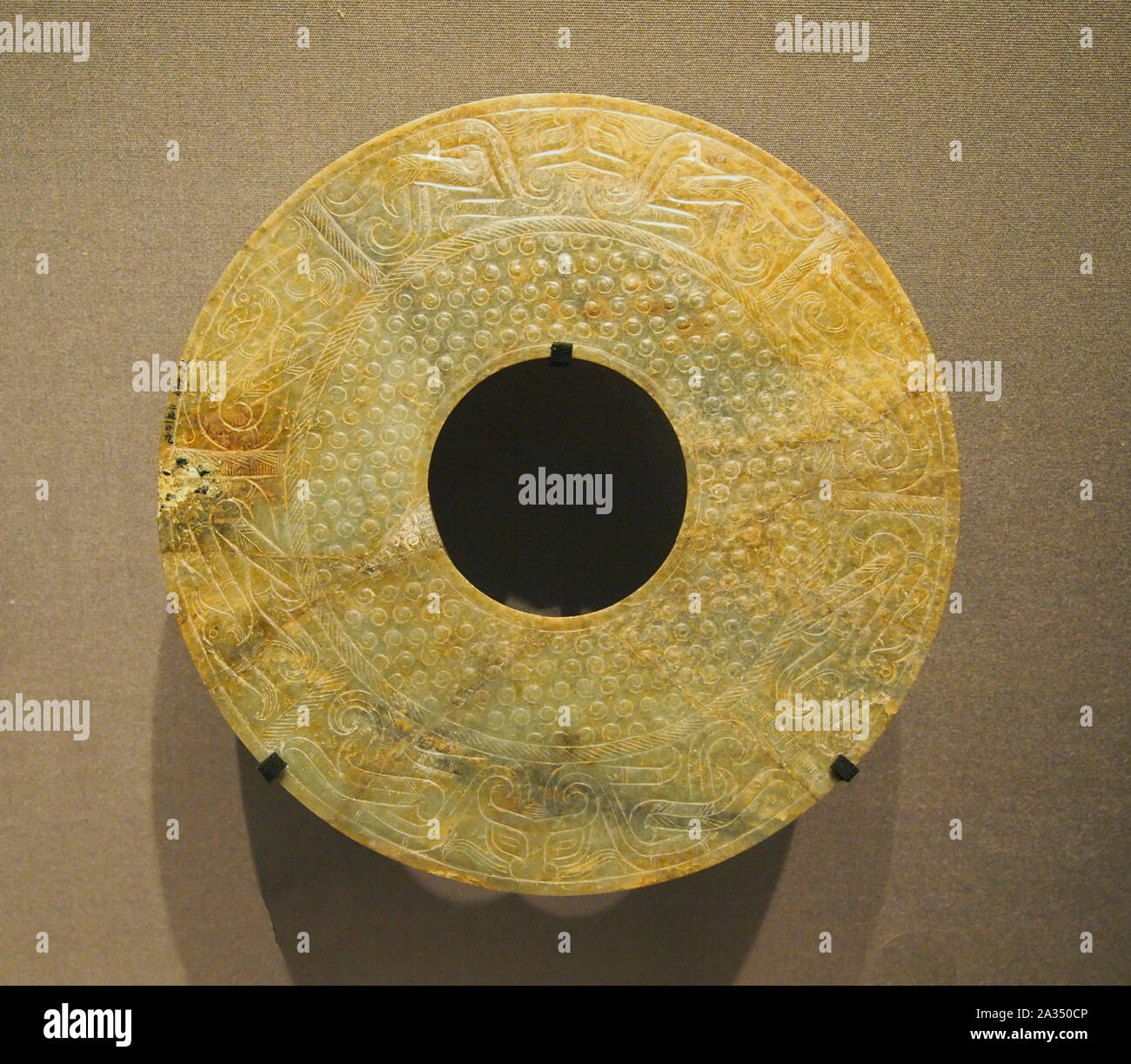 Jade Bi Ornament, Dragon designs. Warring States period-Western Han dinasty, 4th century BC. China Stock Photo