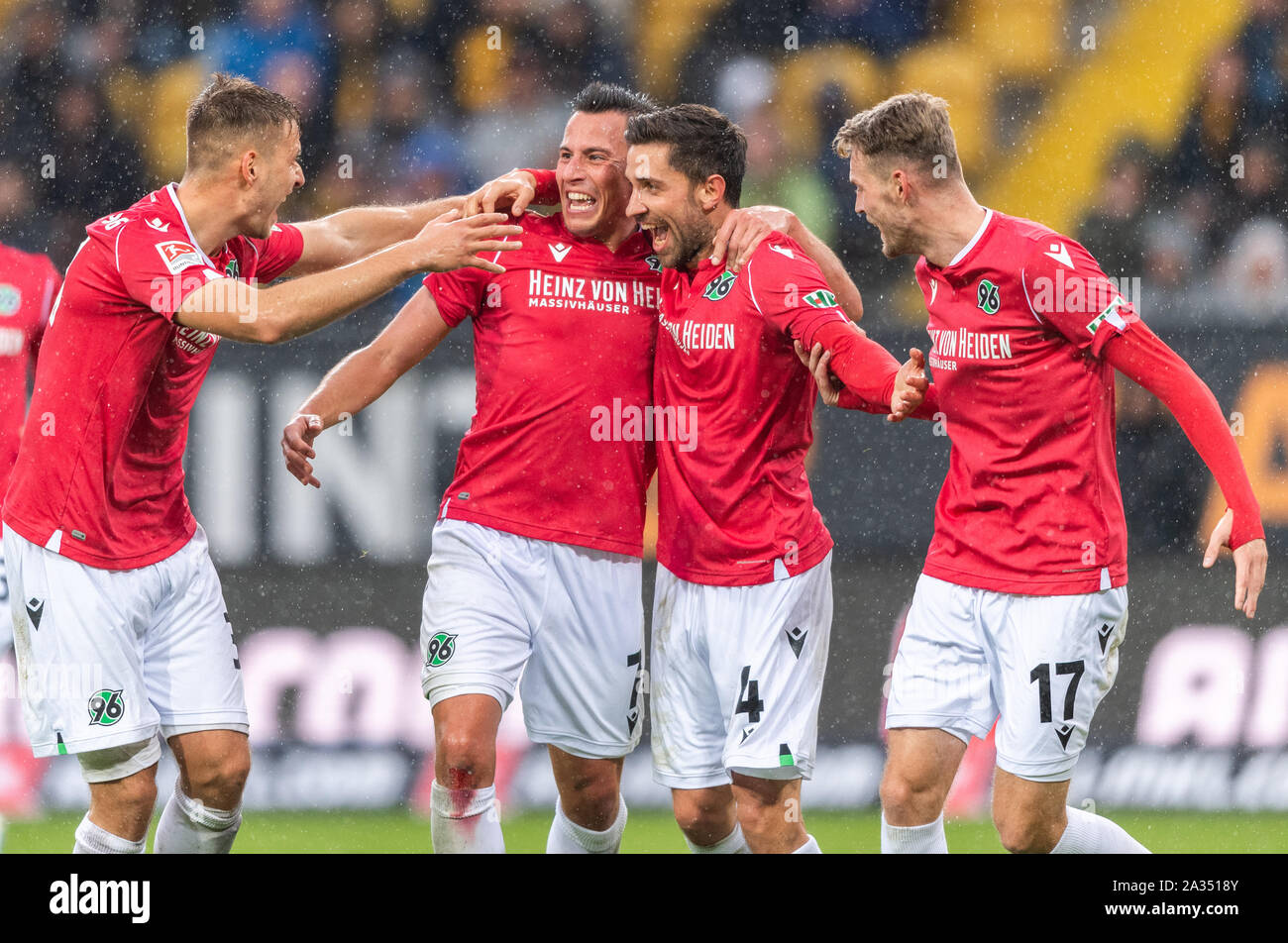 05 October 2019, Saxony, Dresden: Soccer: 2nd Bundesliga, Dynamo Dresden - Hannover 96, Matchday 9, in the Rudolf Harbig Stadium. Hannovers Julian Korb (2nd from right) cheers after his goal to 0:1 with his teammates Miiko Albornoz (l-r), Edgar Prib and Marvin Ducksch. Photo: Robert Michael/dpa-Zentralbild/dpa - IMPORTANT NOTE: In accordance with the requirements of the DFL Deutsche Fußball Liga or the DFB Deutscher Fußball-Bund, it is prohibited to use or have used photographs taken in the stadium and/or the match in the form of sequence images and/or video-like photo sequences. Stock Photo
