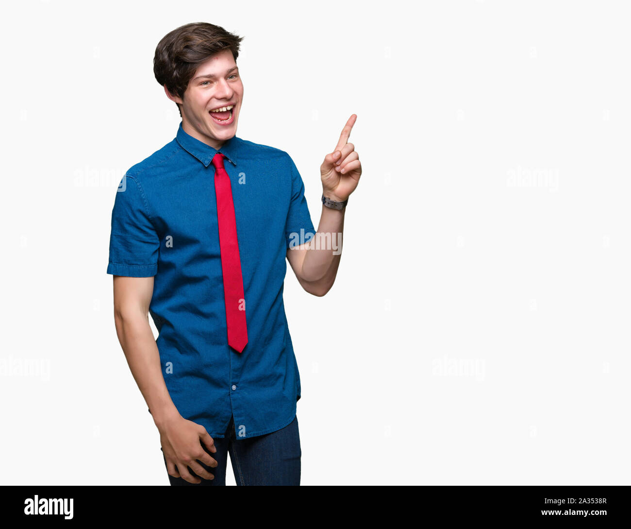 Young handsome business man wearing red tie over isolated background with a big smile on face, pointing with hand and finger to the side looking at th Stock Photo
