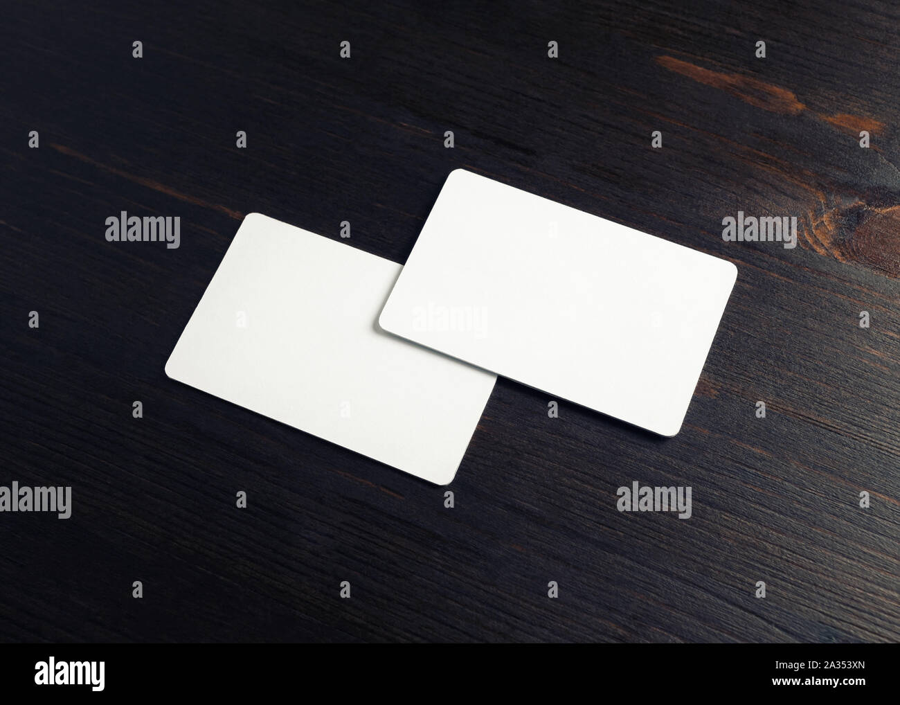 Download Two Blank Business Cards On Wood Table Background Mockup For Branding Identity Stock Photo Alamy