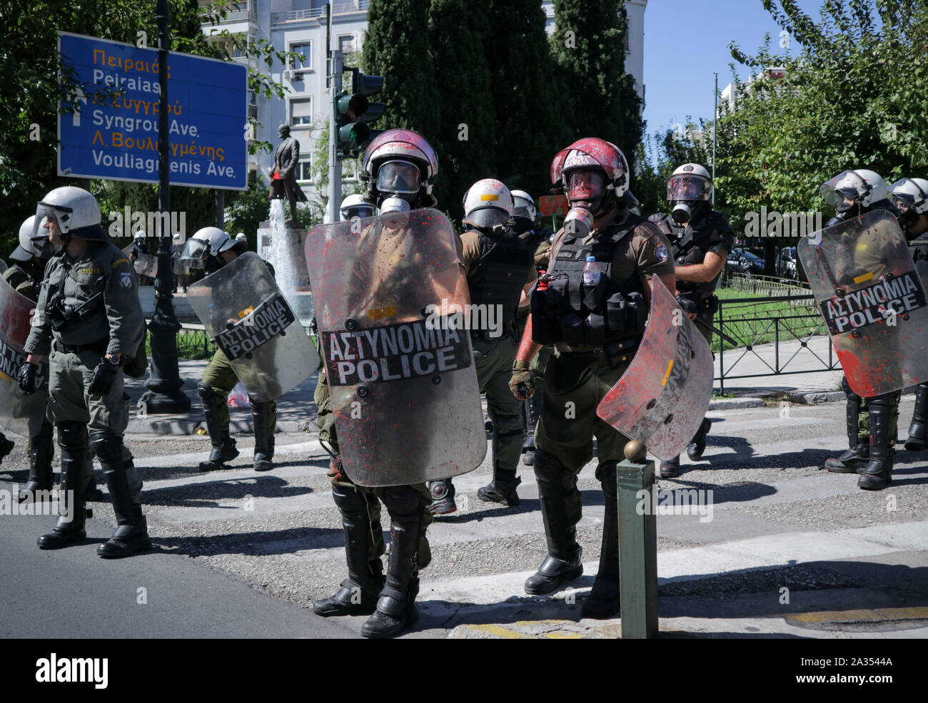Athens - Greece: Riot police after communist-affiliated protesters ...