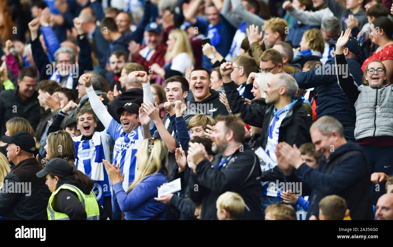 Brighton UK 5th October 2019 -  Brighton fans celebrate during the Premier League match between  Brighton and Hove Albion and Tottenham Hotspur at the Amex Stadium - Editorial use only. No merchandising. For Football images FA and Premier League restrictions apply inc. no internet/mobile usage without FAPL license - for details contact Football Dataco  : Credit Simon Dack TPI / Alamy Live News Stock Photo