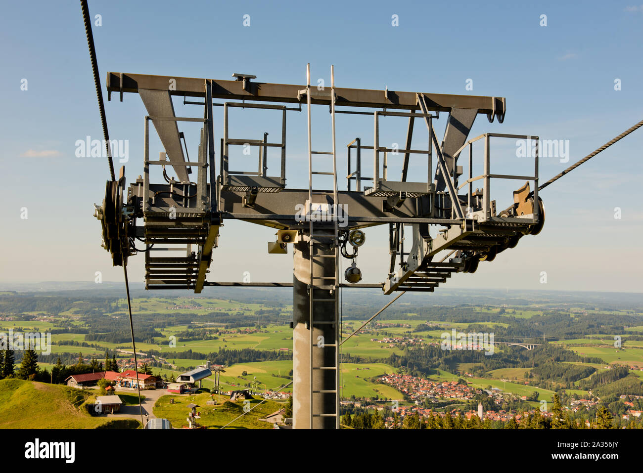 Chairlift mechanism transporting people up and down a high mountain in