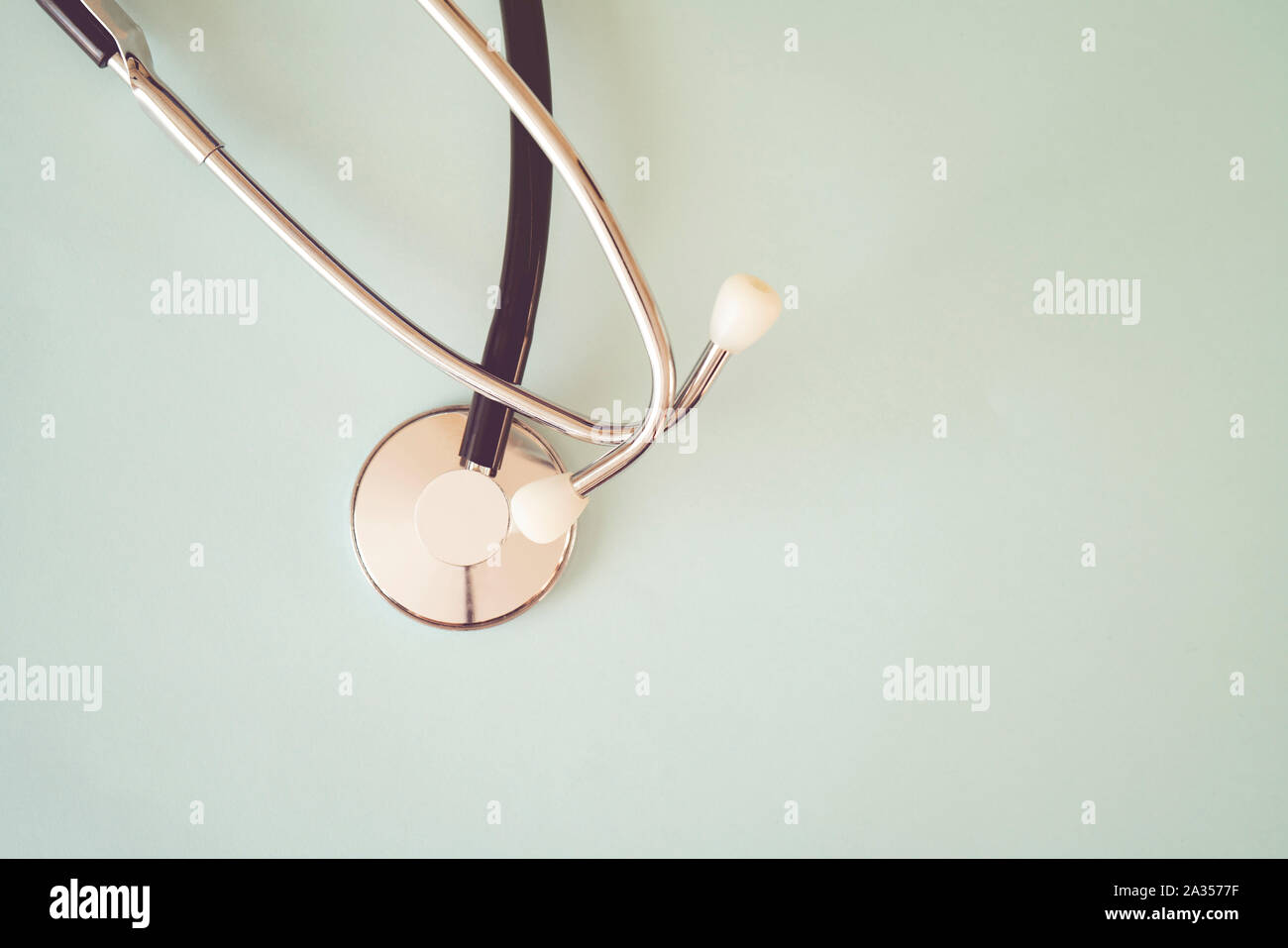 The black stethoscope on a turquoise background Stock Photo