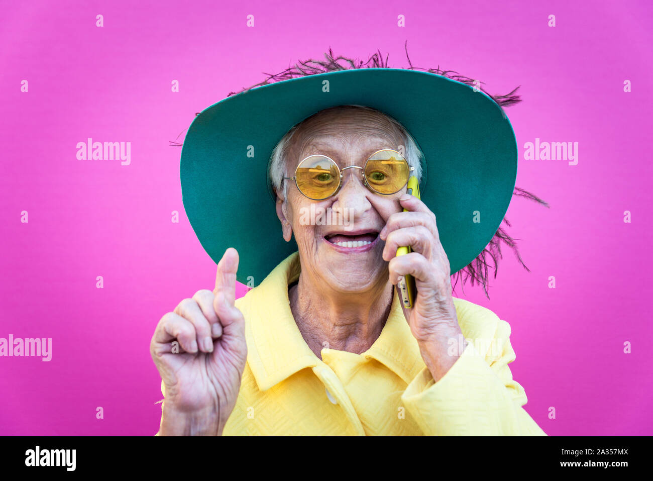 Funny grandmother portraits. Senior old woman, interacting with a smartphone. Concept about seniority Stock Photo