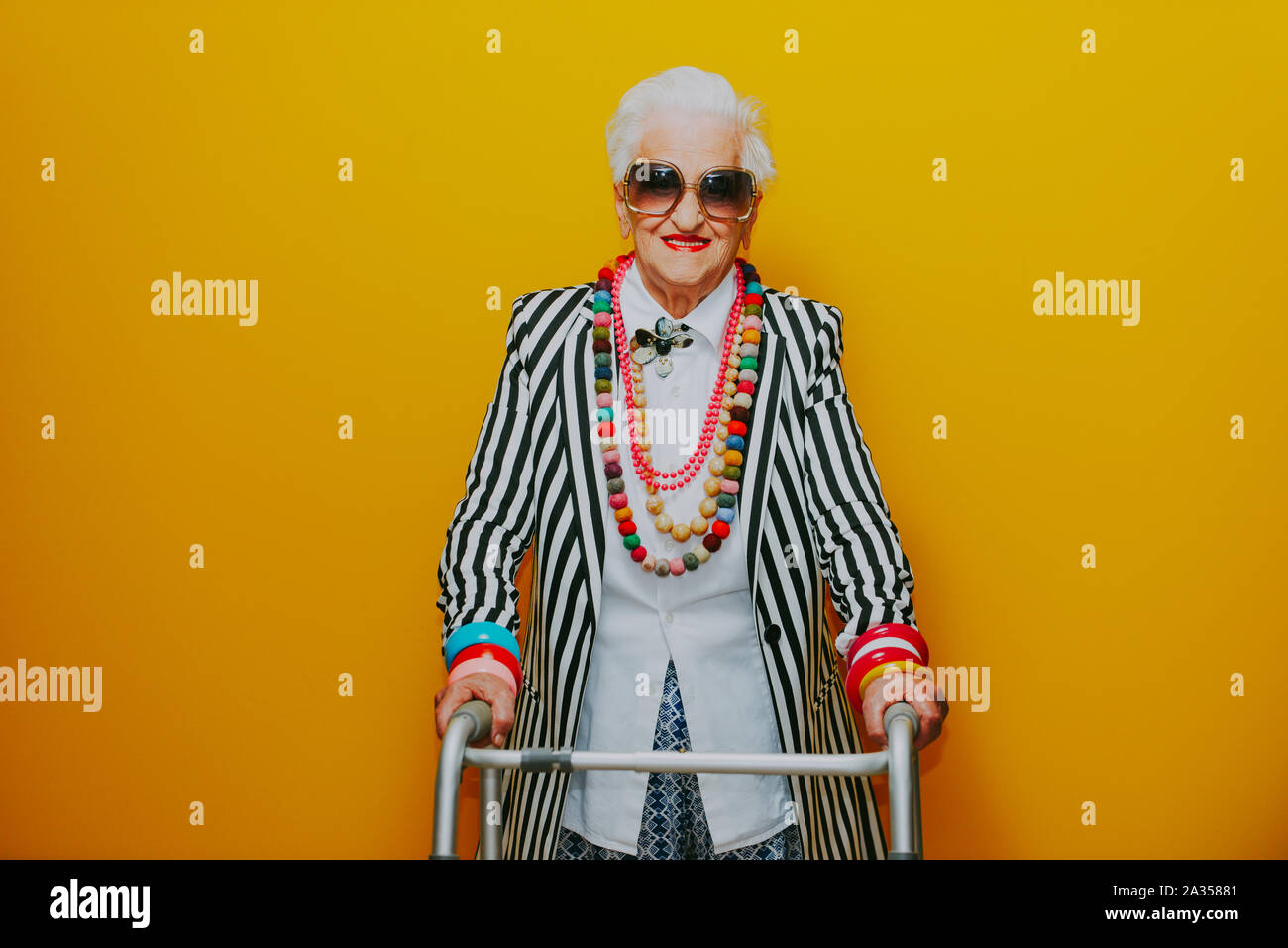 Funny grandmother portraits. Senior old woman dressing elegant for a  special event. granny fashion model on colored backgrounds Stock Photo -  Alamy