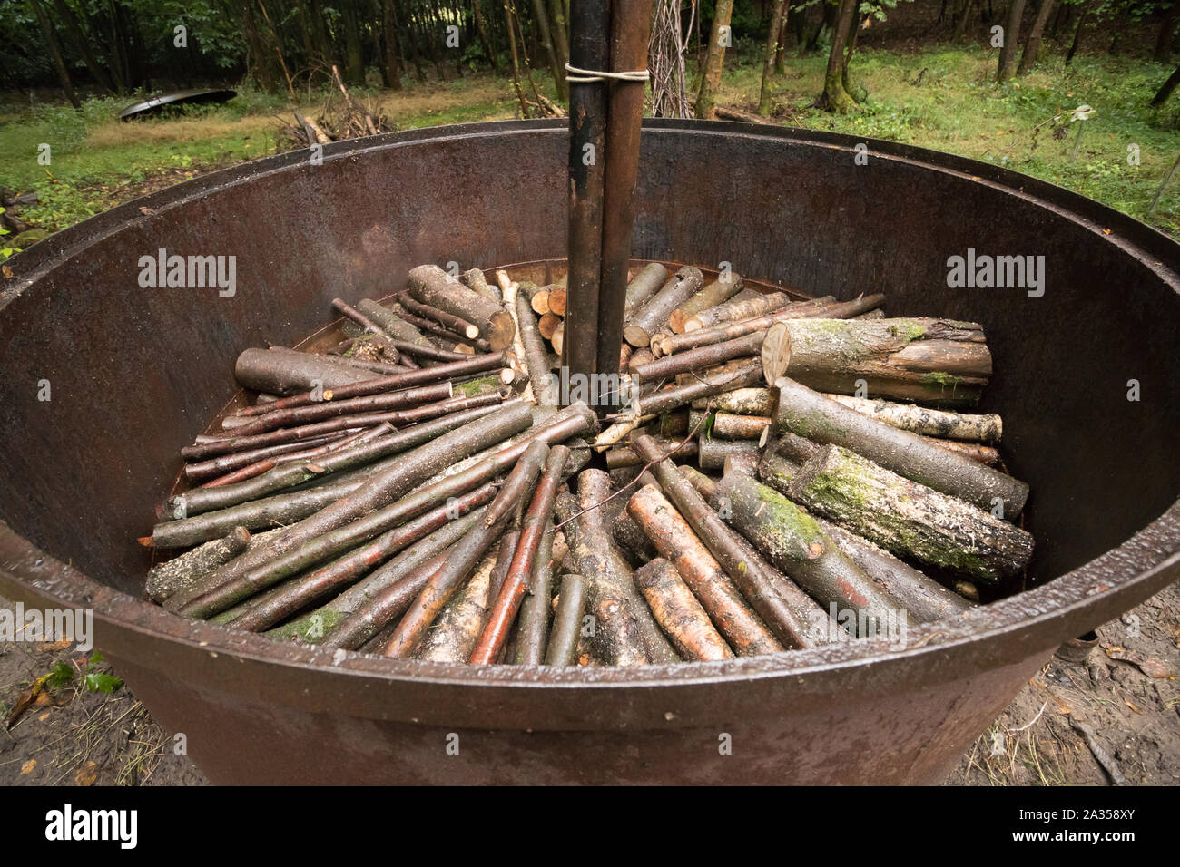 Traditional charcoal kiln stacked with coppiced logs. Surrey, UK Stock