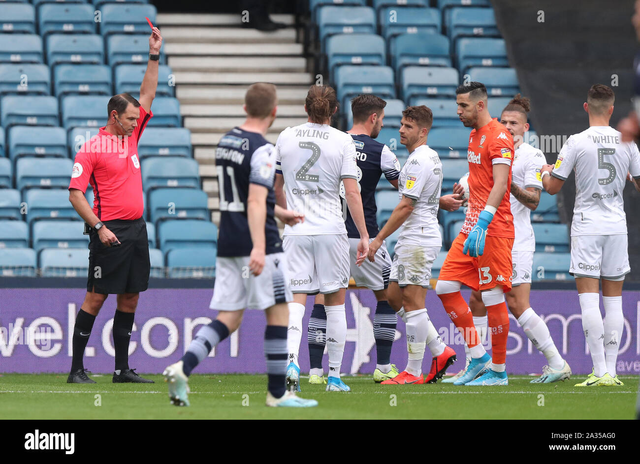 Leeds United's Gaetano Berardi (4th right) is shown a red card by