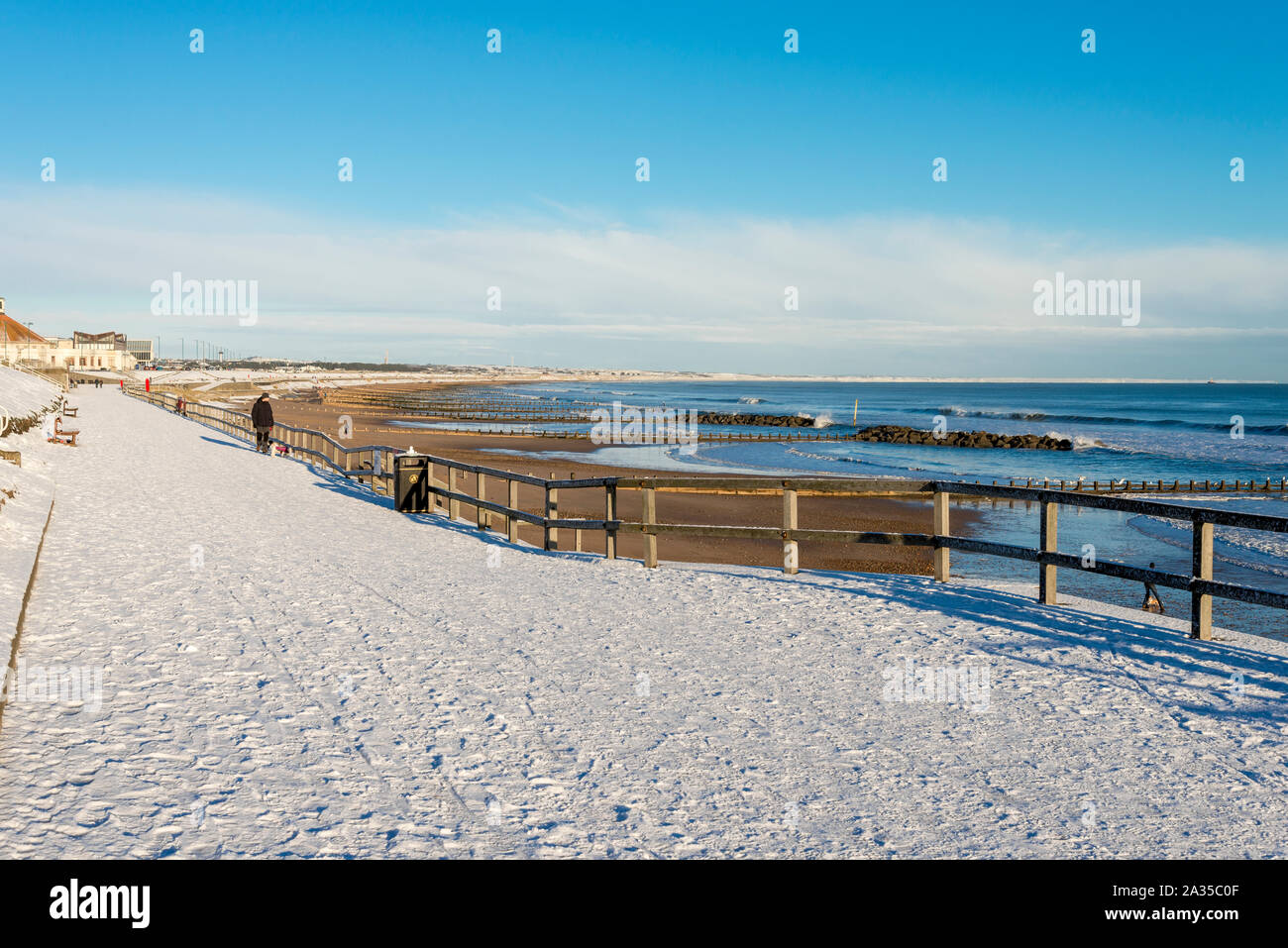 Promenade walk along Aberdeen city beach covered by snow, Scotland Stock Photo