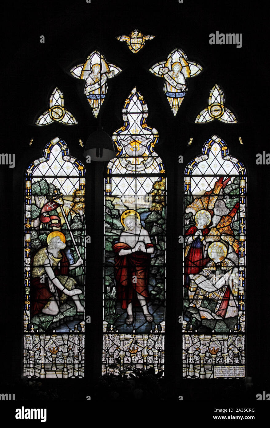 Stained glass window by the Kempe Studios depicting the baptism of Jesus St Peter's Church, Binton, Warwickshire Stock Photo