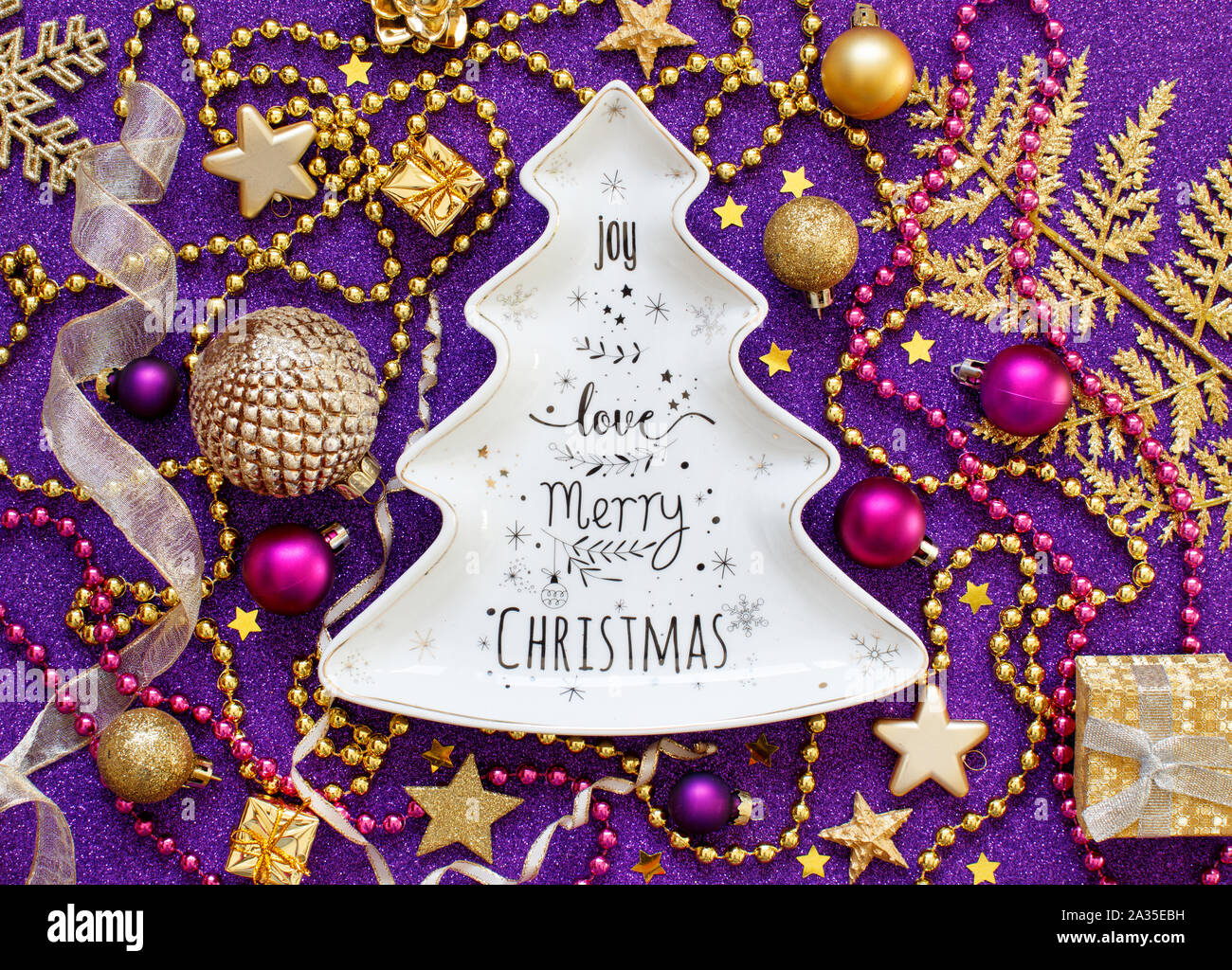 Golden and purple Christmas decorations top view Stock Photo