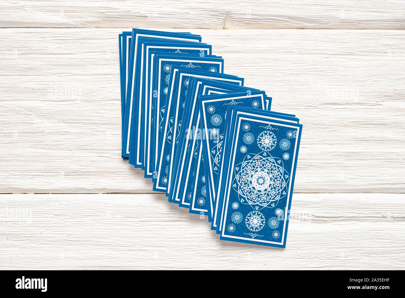 Blue tarot cards deck on white wooden table background Stock Photo - Alamy