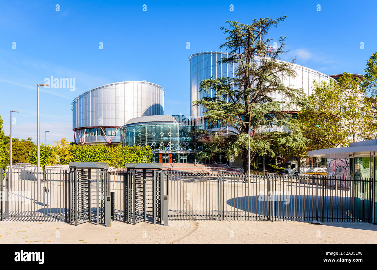 The access to the building of the European Court of Human Rights in Strasbourg, France, is secured by a fence and security turnstiles. Stock Photo