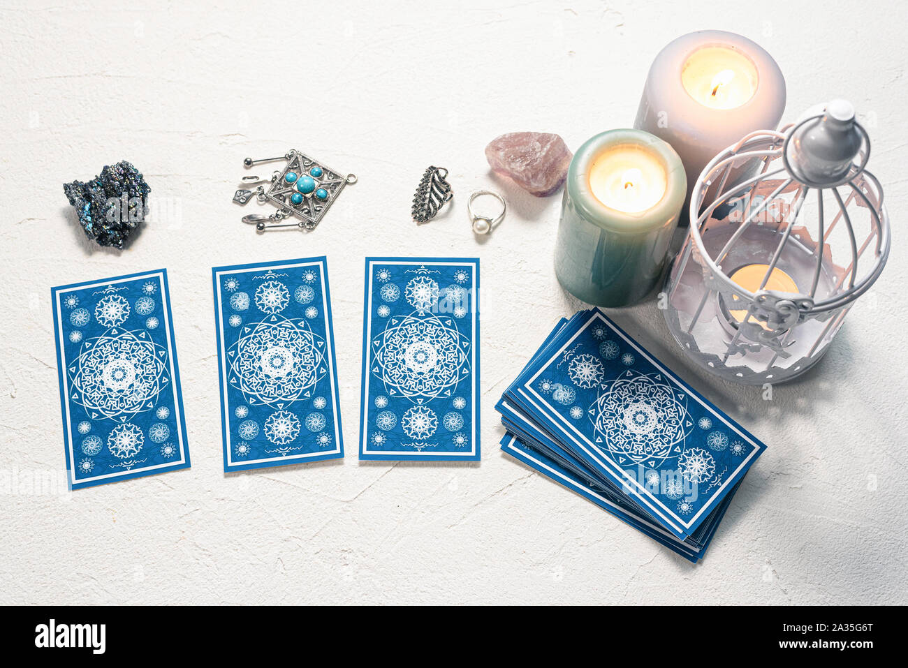 Blue tarot cards on white stone table background Stock Photo - Alamy