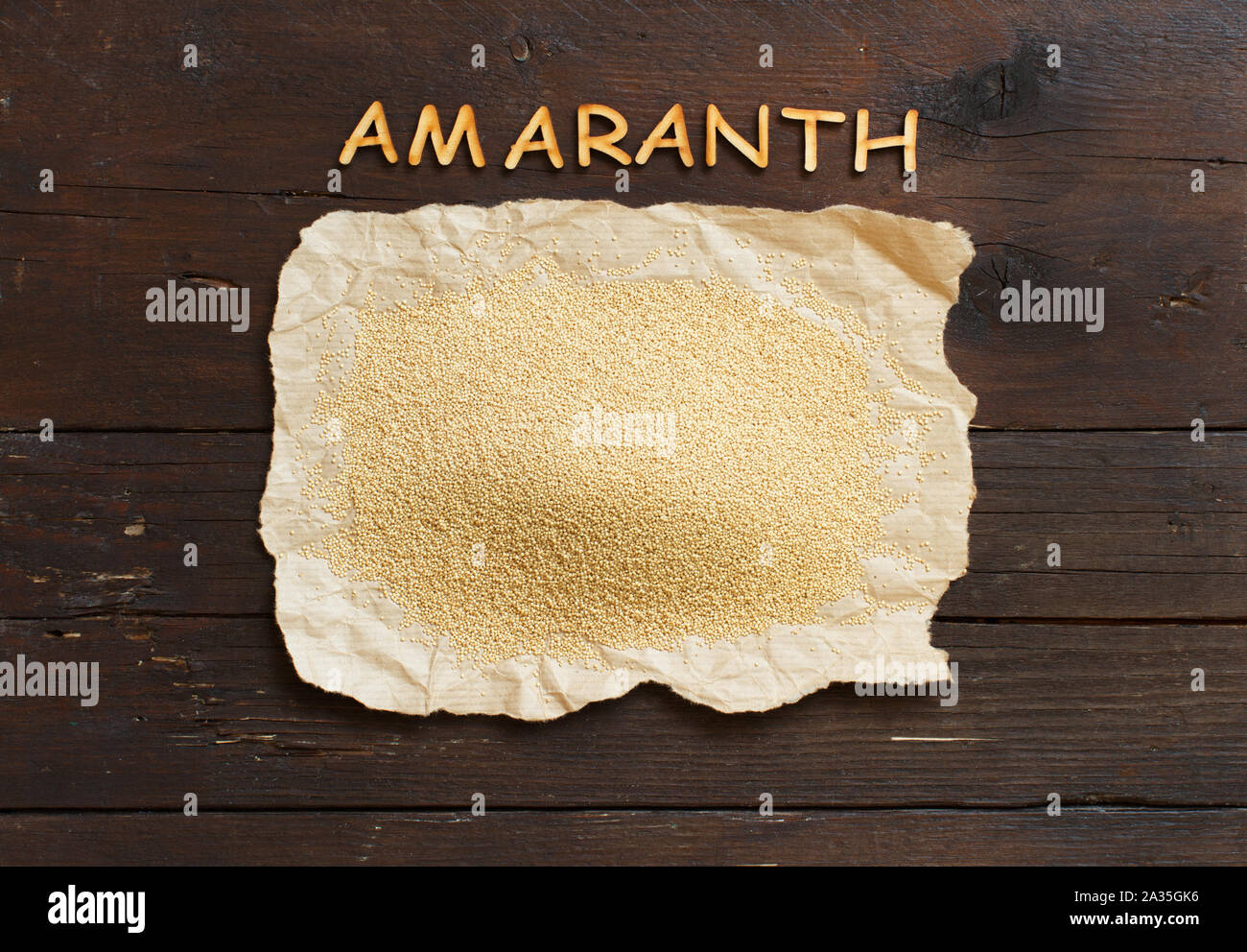 Pile of Raw Organic Amaranth grain with letters Stock Photo