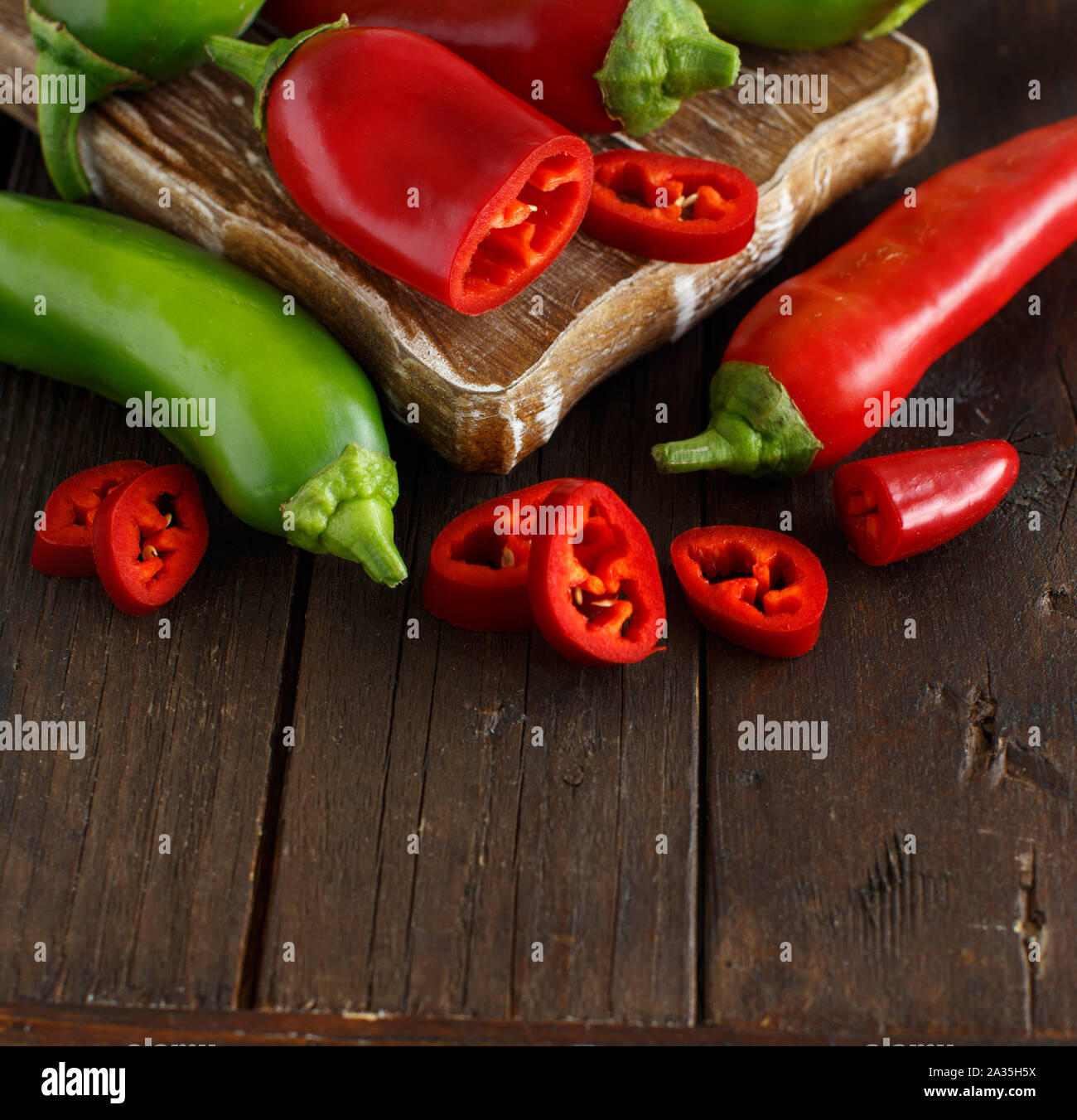 Red and green sweet peppers on dark background Stock Photo - Alamy