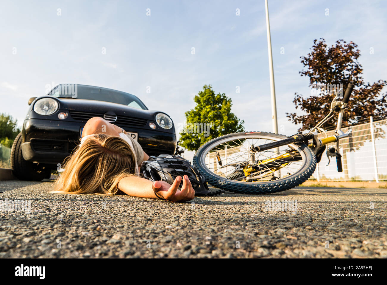 Woman fall bike accident Stock Photo