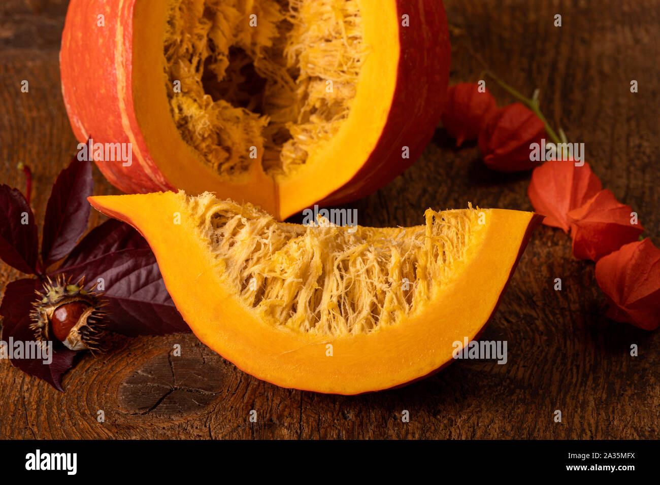 sliced hokkaido pumpkin on wood Stock Photo