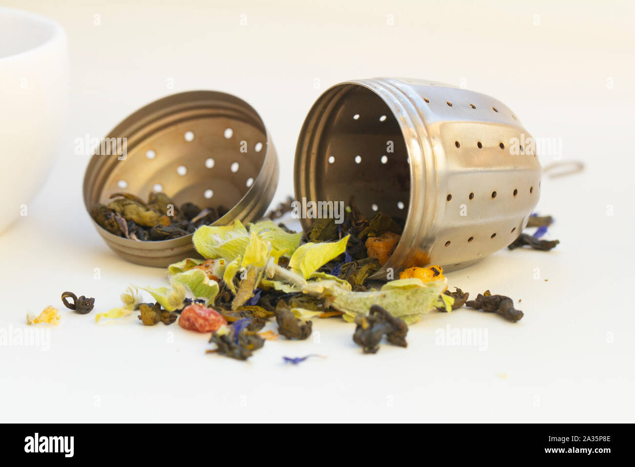 loose herbal tea in tea strainer Stock Photo