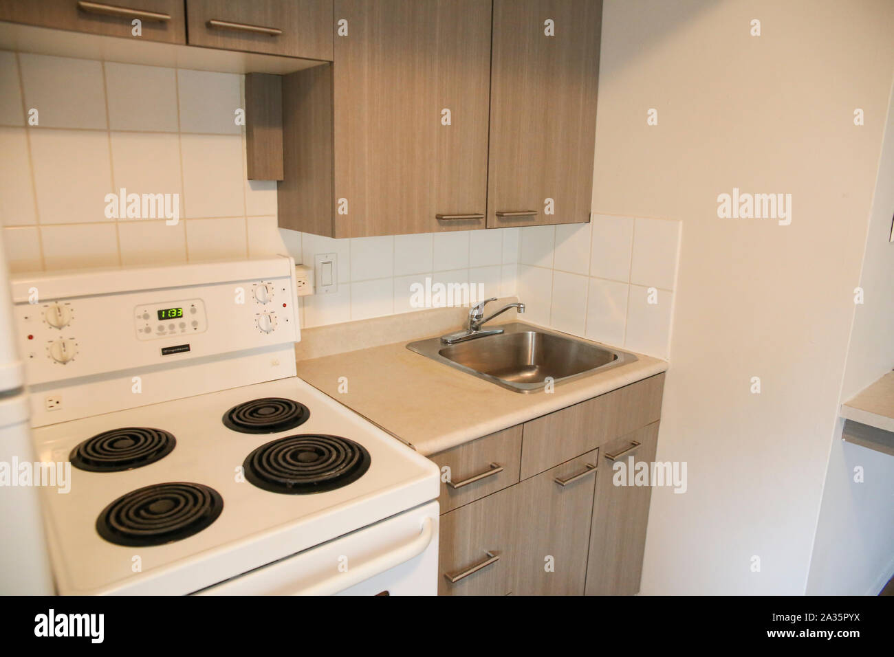 Winnipeg, Manitoba / Canada - September 22, 2019: Tiny apartment kitchen. Stock Photo