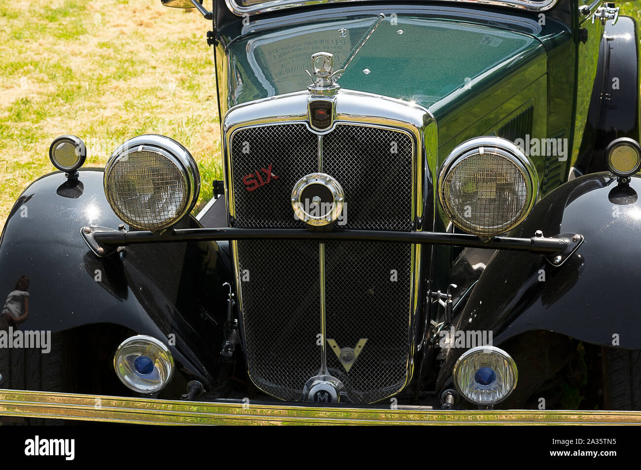 The front of a green 1930's Morris 10/6 on display at a car show Stock Photo