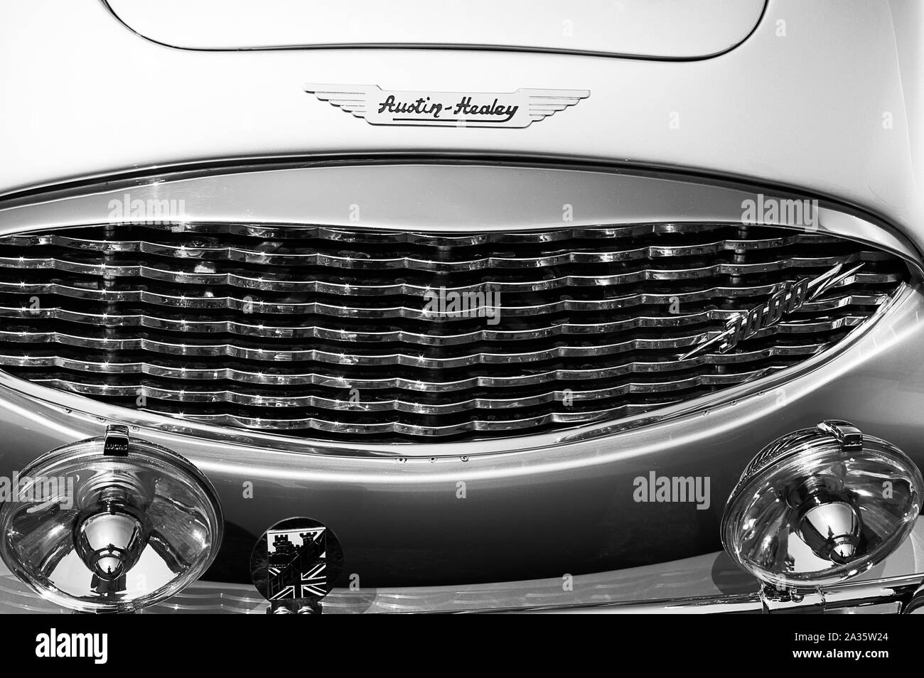 The front of a blue 1960 Austin Healey on display at a car show Stock Photo