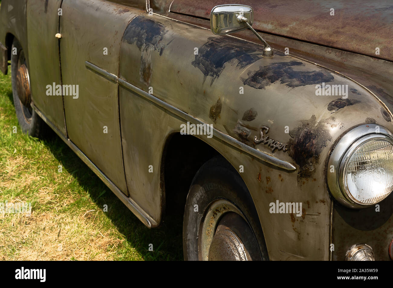 The side of a brown 1956 Singer Hunter on display at a car show Stock ...