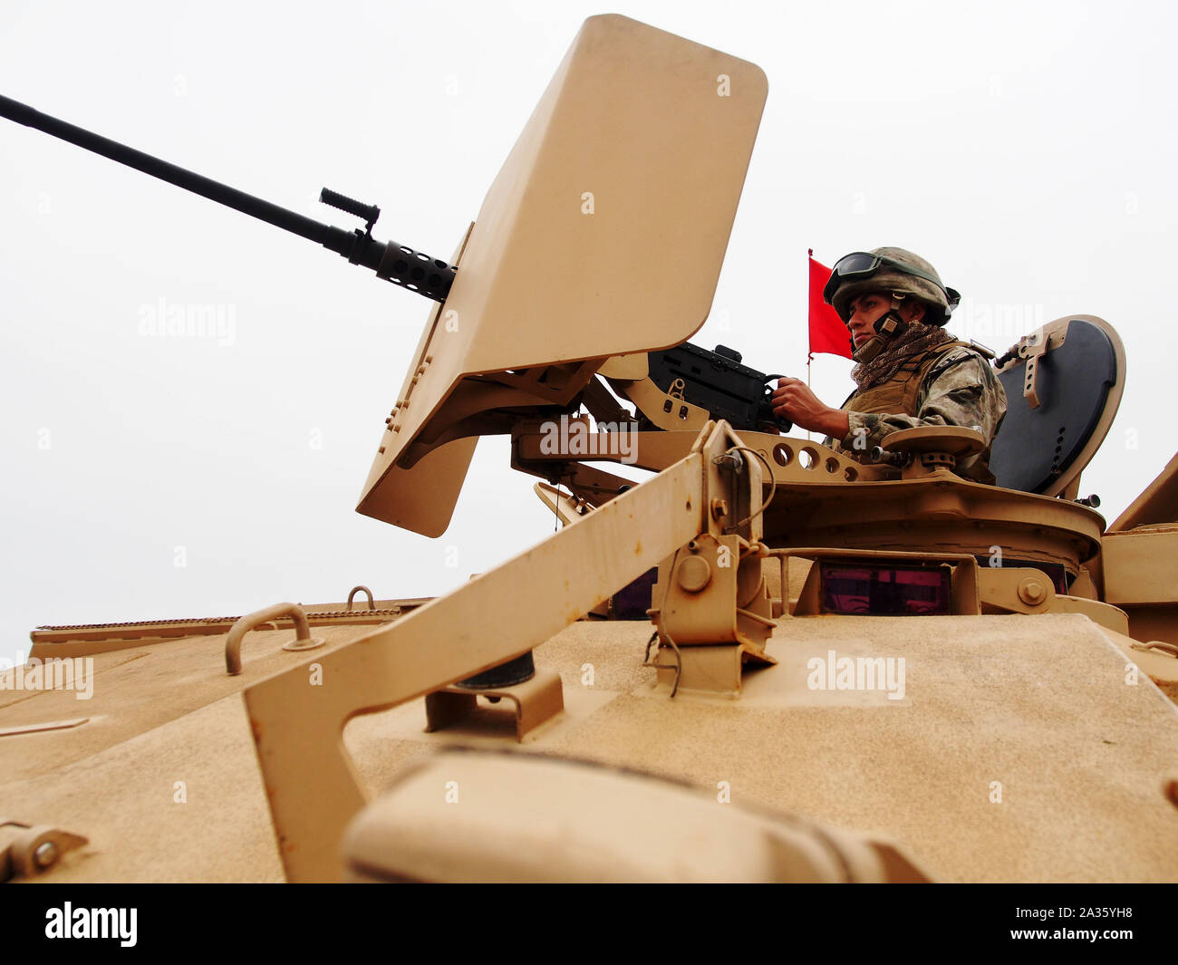 Peruvian Marine handling a Cal .50 BMG machine gun on top of an armoured amphibious vehicle (ASLAV-II) at  Miraflores Bay during the 'Velas Latinoamerica 2018'  nautical event, which takes place in Lima Peru. The event congregates 10 training sailing ships from Latin-American countries and Spain. Stock Photo