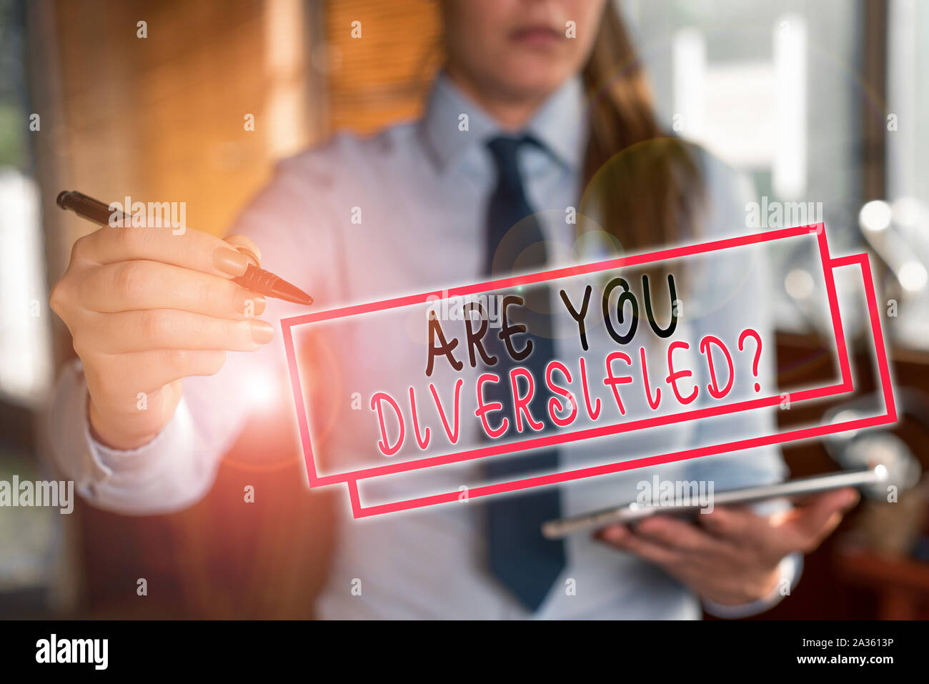 Text sign showing Are You Diversified Question. Business photo text someone who is Different Mixed Multi Faceted Blurred woman in the background point Stock Photo