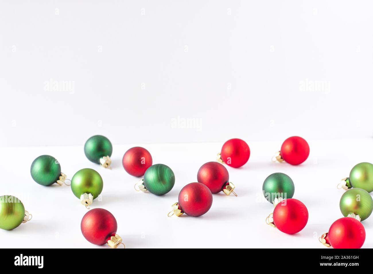 Christmas balls of red and green colors on white background. Xmas concept with space for text Stock Photo