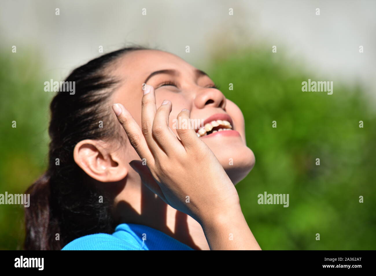 An An Adult Female Laughing Stock Photo