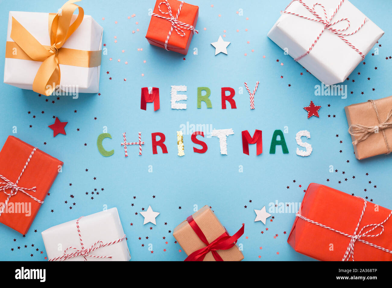 Different presents in boxes on blue winter background Stock Photo