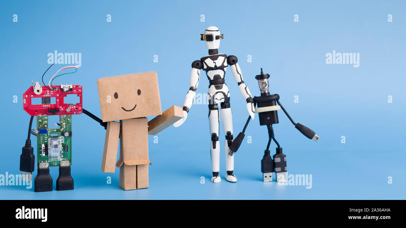 Four different handmade robots on blue background Stock Photo