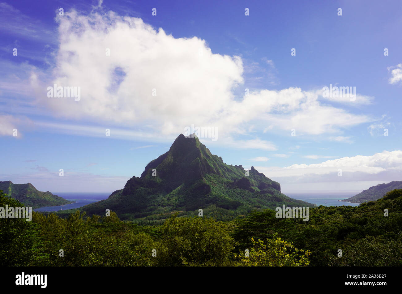 View of green Rotui mountain from Belvedere lookout on the island of Moorea in French Polynesia; copy space Stock Photo