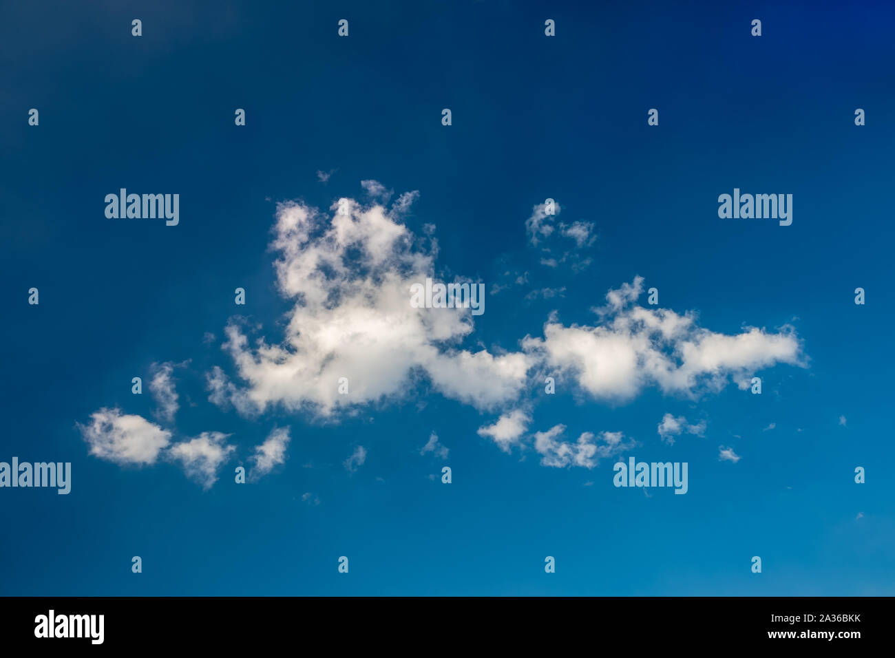 White cloud in the middle of blue sky. Stock Photo