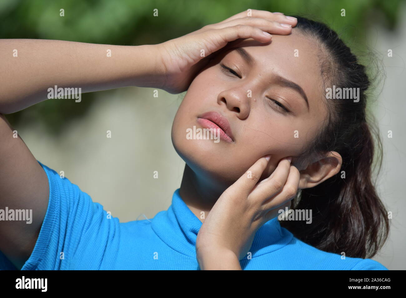 An Asian Female And Soreness Stock Photo
