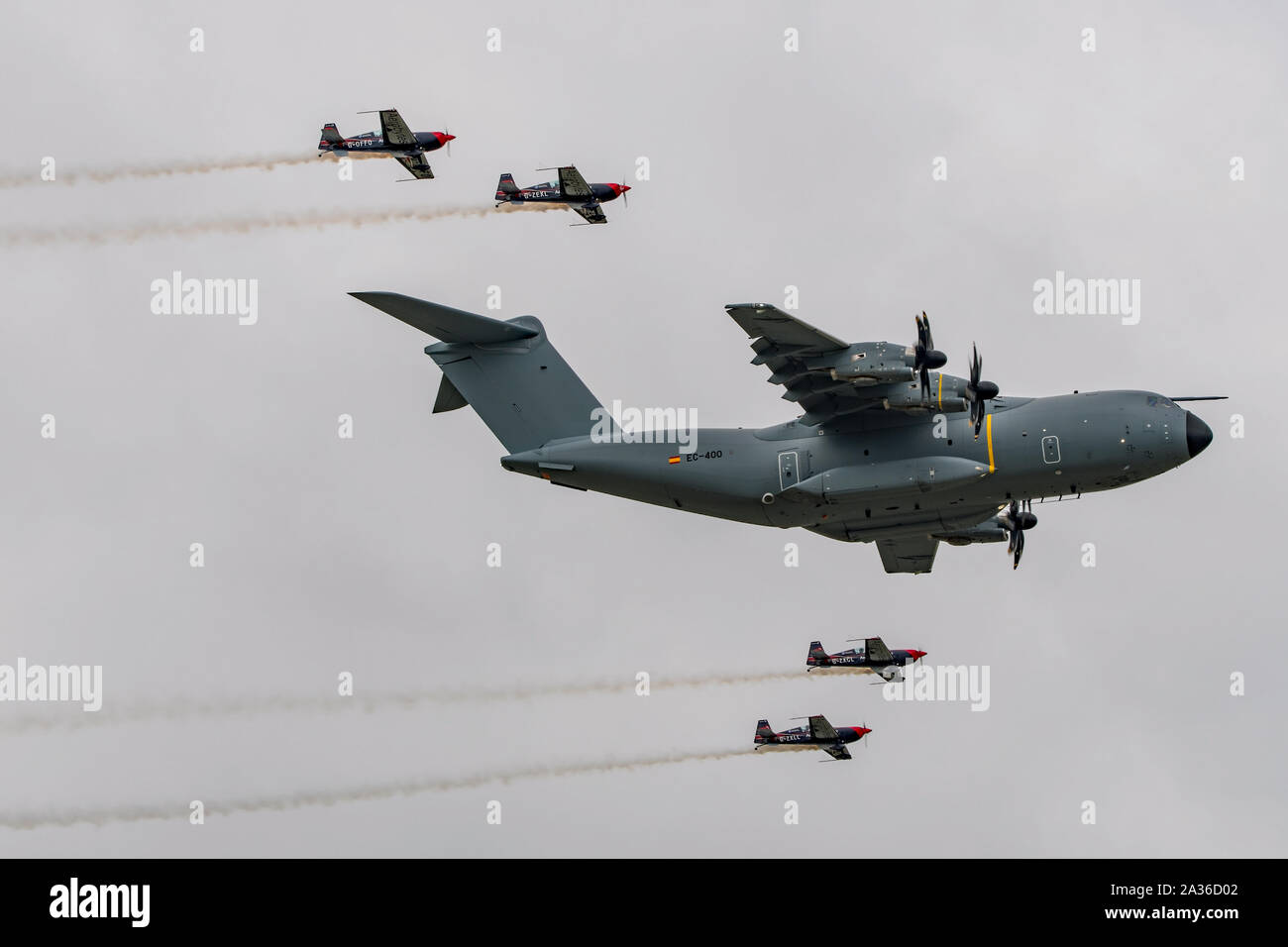 Airbus A400M Atlas in a formation flypast with The Blades aerobatic display team at RIAT 2019, RAF Fairford, UK on the 21st July 2019. Stock Photo