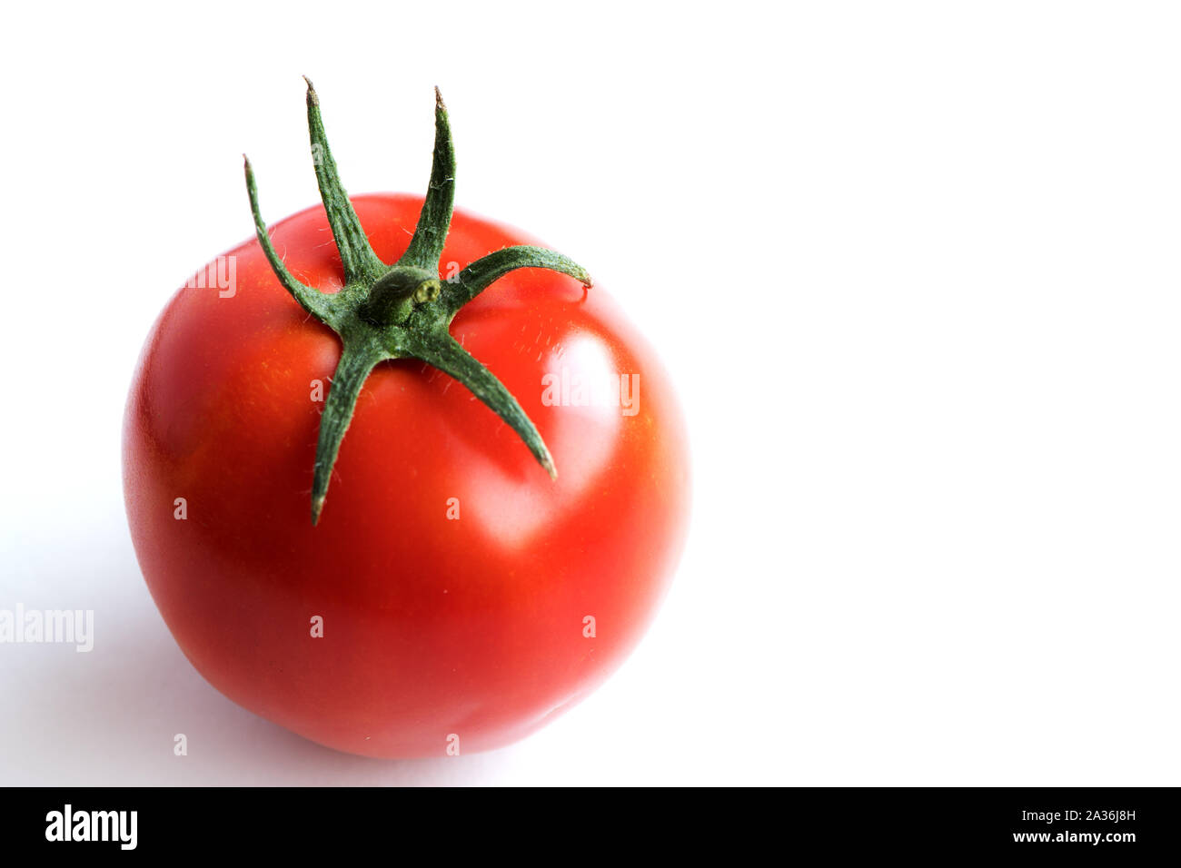 Jucy red tomato. Close up of freshness and health concept on white background Stock Photo
