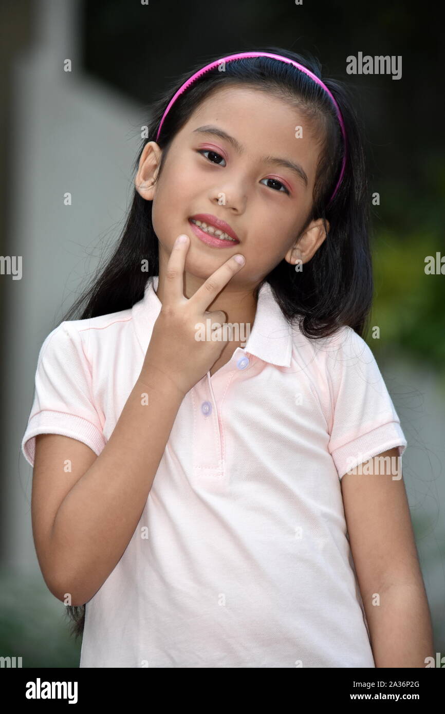 Young Asian Girl Making A Decision Stock Photo
