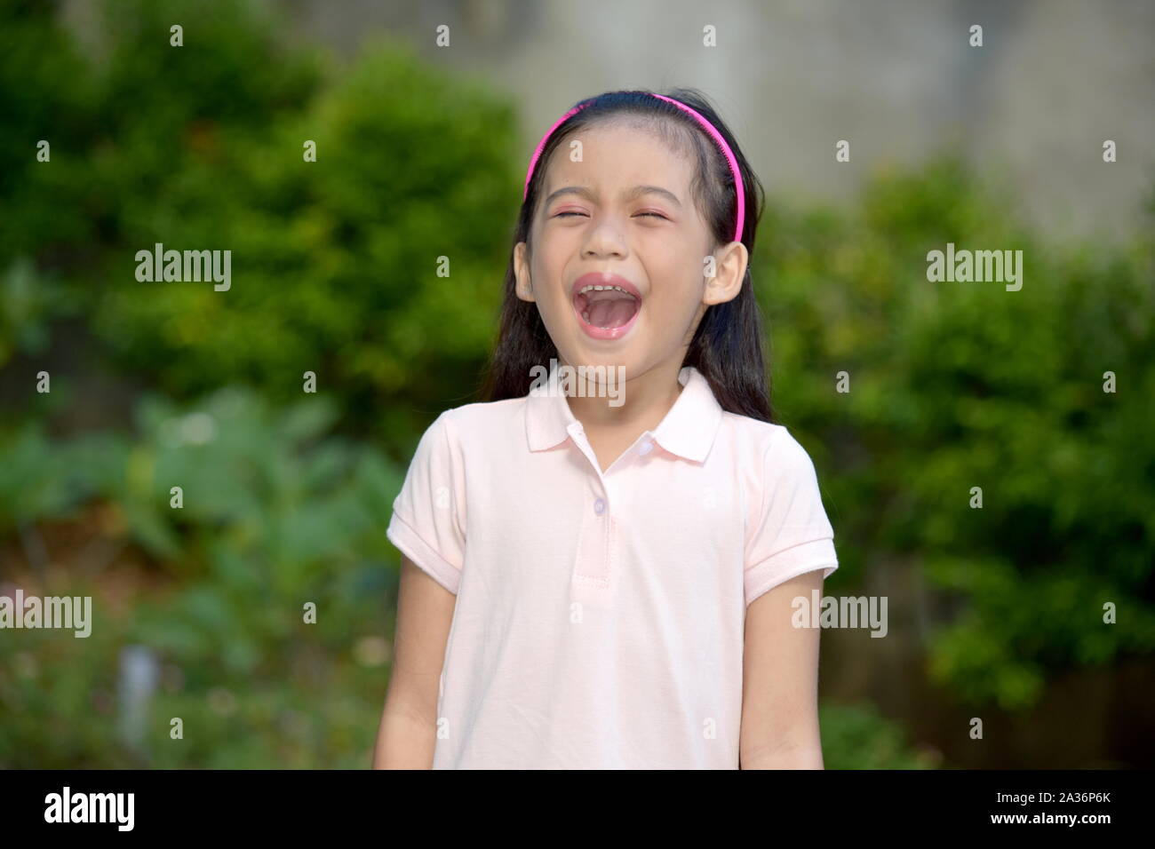 An An Asian Girl Yelling Stock Photo