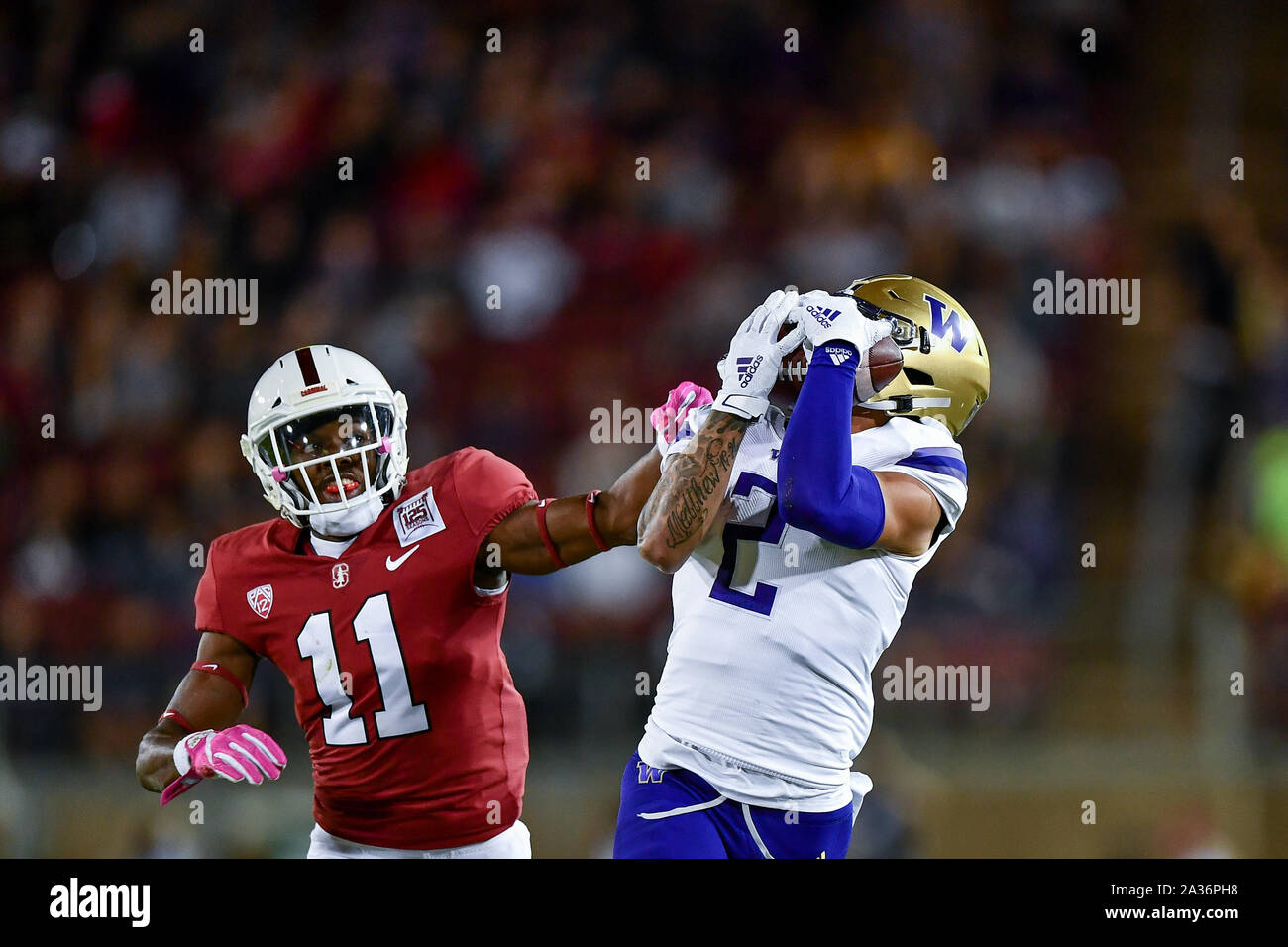 Stanford, California, USA. 05th Oct, 2019. Washington Huskies wide receiver Aaron Fuller (2) makes the catch on the sideline ahead of Stanford Cardinal cornerback Paulson Adebo (11) during the NCAA football game between the Washington Huskies and the Stanford Cardinal at Stanford Stadium in Stanford, California. Chris Brown/CSM/Alamy Live News Stock Photo