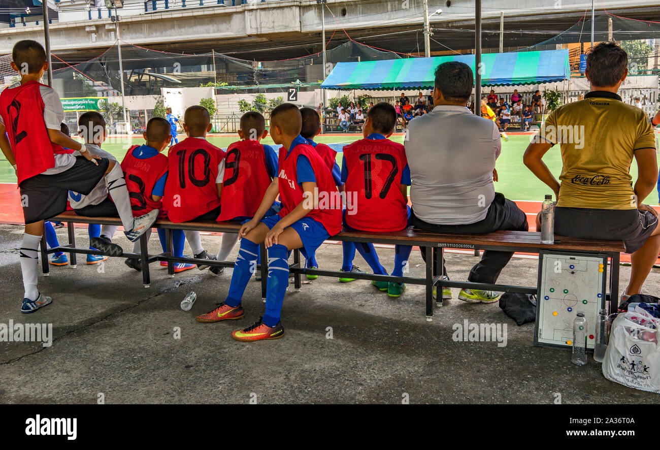 Schoolboys playing Football (Soccer) in Bangkok Thailand. Colourful Image Stock Photo